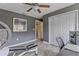 This versatile room doubles as an office and gym, with a stylish grey color and wood floors at 5618 Sheer Bliss Loop, Land O Lakes, FL 34639