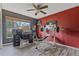 This versatile room doubles as an office and gym, with a striking accent wall and plenty of natural light at 5618 Sheer Bliss Loop, Land O Lakes, FL 34639