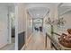Hallway with wood floors, neutral walls, and archways leading to bedrooms and a living area at 5618 Sheer Bliss Loop, Land O Lakes, FL 34639
