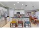Bright kitchen with a stone-accented island, stainless steel appliances, and adjacent dining area at 5618 Sheer Bliss Loop, Land O Lakes, FL 34639