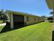 Exterior view of the home and backyard at 6121 35Th E Ct, Bradenton, FL 34203