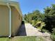 Backyard patio view showcasing exterior of home and greenery at 6121 35Th E Ct, Bradenton, FL 34203
