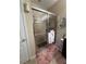 En suite bath featuring a glass-enclosed shower with sleek fixtures and neutral tiling at 6121 35Th E Ct, Bradenton, FL 34203