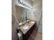 Beautiful bathroom boasts double sinks, granite countertops, and a large mirror with modern lighting at 6121 35Th E Ct, Bradenton, FL 34203