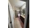 Bathroom with granite counters, dark cabinets and glass shower enclosure at 6121 35Th E Ct, Bradenton, FL 34203