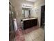 Spacious bathroom with a double sink vanity, granite countertops, and a walk-in shower at 6121 35Th E Ct, Bradenton, FL 34203