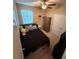 Bedroom with ceiling fan, window and closet at 6121 35Th E Ct, Bradenton, FL 34203