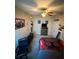 View of a well-lit bedroom with carpet, a ceiling fan, and furnishings at 6121 35Th E Ct, Bradenton, FL 34203