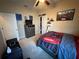Stylish bedroom featuring modern carpet, ceiling fan, and built-in storage at 6121 35Th E Ct, Bradenton, FL 34203
