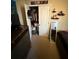View of an organized closet with clothing and storage containers at 6121 35Th E Ct, Bradenton, FL 34203