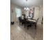 Dining room featuring a sleek dining set, modern lighting, and elegant decor at 6121 35Th E Ct, Bradenton, FL 34203