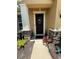 Stylish front door with stone accents and unique decor creates a warm welcome at 6121 35Th E Ct, Bradenton, FL 34203