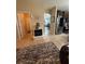 Hallway boasts tile flooring, with a decorative electric fireplace, connecting the laundry, living areas, and kitchen at 6121 35Th E Ct, Bradenton, FL 34203