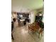 Open kitchen with granite countertops, island seating, stainless appliances, and a cozy breakfast nook at 6121 35Th E Ct, Bradenton, FL 34203