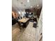 Open kitchen featuring island seating, stainless steel appliances, and stylish cabinetry at 6121 35Th E Ct, Bradenton, FL 34203