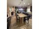 Open kitchen with a large granite island, stainless appliances, and plenty of seating, great for gatherings at 6121 35Th E Ct, Bradenton, FL 34203
