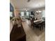 Open-concept living spaces with tile floors, neutral decor, and a fireplace, great for entertaining at 6121 35Th E Ct, Bradenton, FL 34203