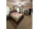 Spacious bedroom boasts neutral walls, plush carpet, ceiling fan, and stylish, decorative accents at 6121 35Th E Ct, Bradenton, FL 34203