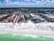 Panoramic aerial view of the beachfront condominiums next to a beautiful beach at 6512 Midnight Pass Rd # 301, Sarasota, FL 34242
