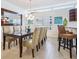 Beautiful dining area with modern light fixture and view of the kitchen at 6512 Midnight Pass Rd # 301, Sarasota, FL 34242