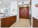 Modern kitchen with stainless steel appliances, wood cabinets, and white countertops at 6512 Midnight Pass Rd # 301, Sarasota, FL 34242