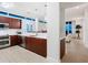 Modern kitchen with sleek countertops, stainless steel appliances, and lots of light at 6512 Midnight Pass Rd # 301, Sarasota, FL 34242