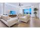 Spacious living room with plenty of seating and ocean view; perfect for relaxing and entertaining at 6512 Midnight Pass Rd # 301, Sarasota, FL 34242