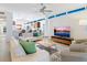 Bright living room with stylish white sofas, modern decor, and open floor plan at 6512 Midnight Pass Rd # 301, Sarasota, FL 34242