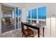 Bedroom/Office featuring a custom desk, natural light, and breathtaking views of the Gulf of Mexico at 6512 Midnight Pass Rd # 301, Sarasota, FL 34242