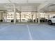 Clean, well-lit, and secure parking garage with designated parking spots for residents and guests at 6512 Midnight Pass Rd # 301, Sarasota, FL 34242