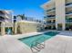 Outdoor pool with a white tiled sundeck, perfect for relaxation and recreation at 6512 Midnight Pass Rd # 301, Sarasota, FL 34242
