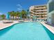 Spacious pool area with comfortable lounge chairs and tropical views at 6512 Midnight Pass Rd # 301, Sarasota, FL 34242