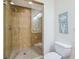This bathroom features a walk-in tiled shower with glass door at 6512 Midnight Pass Rd # 301, Sarasota, FL 34242