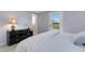 Bedroom with serene views and a convenient access to the en-suite bathroom at 7160 Myakka Valley Trl, Sarasota, FL 34241