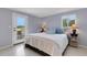 Light-filled bedroom with access to an outdoor patio showcasing serene natural views at 7160 Myakka Valley Trl, Sarasota, FL 34241