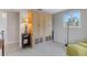 Cozy bedroom featuring built-in closet space and a tranquil view from the window at 7160 Myakka Valley Trl, Sarasota, FL 34241