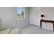 Bright bedroom with a large window and closet featuring a classic console table at 7160 Myakka Valley Trl, Sarasota, FL 34241