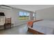 Bright bedroom with big window views of the surrounding land at 7160 Myakka Valley Trl, Sarasota, FL 34241