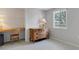 Bright bedroom featuring natural light, a built-in desk, and a tranquil outdoor view at 7160 Myakka Valley Trl, Sarasota, FL 34241