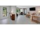 Open living area with lots of natural light, wood accents, and comfortable furniture arrangement at 7160 Myakka Valley Trl, Sarasota, FL 34241