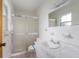 Bathroom with a shower and marble countertop sink at 7803 2Nd W Ave, Bradenton, FL 34209