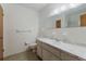 Bathroom with a large mirror, vanity, and a toilet with white tile flooring at 7803 2Nd W Ave, Bradenton, FL 34209
