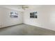Bedroom featuring neutral wall color and two windows allowing ample natural light at 7803 2Nd W Ave, Bradenton, FL 34209