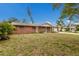 Traditional brick home with a classic design and a neatly kept lawn, showcasing suburban charm at 7803 2Nd W Ave, Bradenton, FL 34209