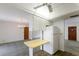 Eat-in kitchen with open concept, white appliances, and neutral counter at 7803 2Nd W Ave, Bradenton, FL 34209