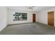 Spacious living room with large window, showing the house’s interior design and layout at 7803 2Nd W Ave, Bradenton, FL 34209