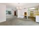 Open-concept living space with view into the kitchen and living room, perfect for Gathering interactions at 7803 2Nd W Ave, Bradenton, FL 34209