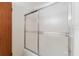 Shower stall with a glass sliding door and tiled walls at 7803 2Nd W Ave, Bradenton, FL 34209