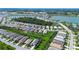 A sprawling community with a lake and sidewalks provides a sense of belonging at 8077 Sandstar Way, Sarasota, FL 34240