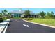 The community clubhouse has manicured landscaping and inviting curb appeal at 8077 Sandstar Way, Sarasota, FL 34240